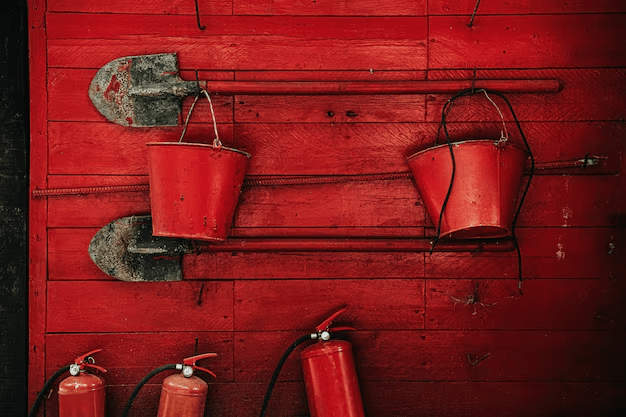 fire-extinguishing-tools-shovels-buckets-fire-extinguishers-red-wooden-wall_473133-50